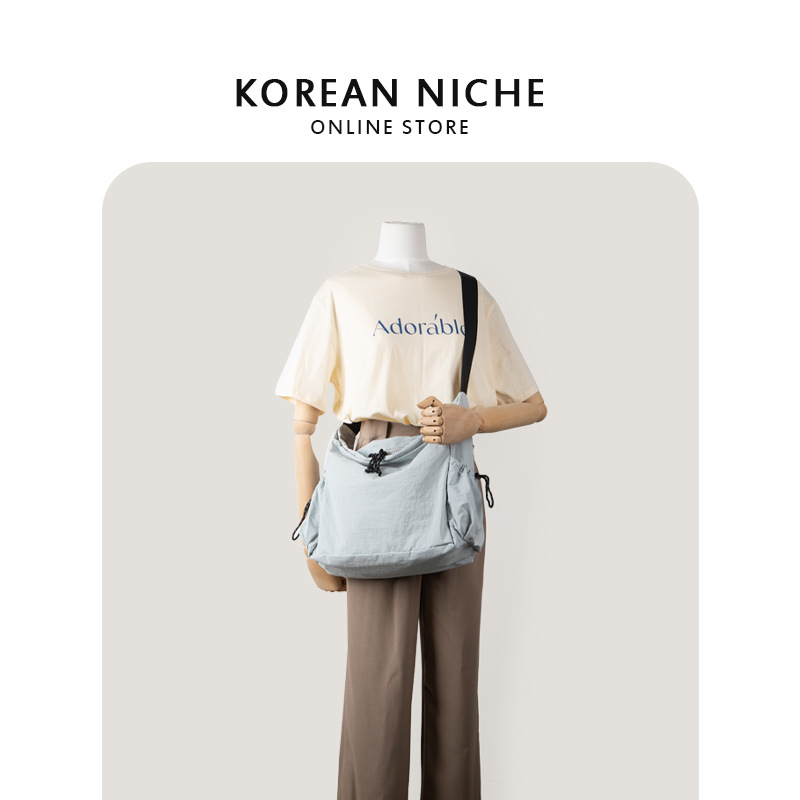 Nuevo estilo coreano versátil casual bolsa de asas de nylon para estudiantes mujeres nicho diseño ligero de gran capacidad hombro mensajero bolsa