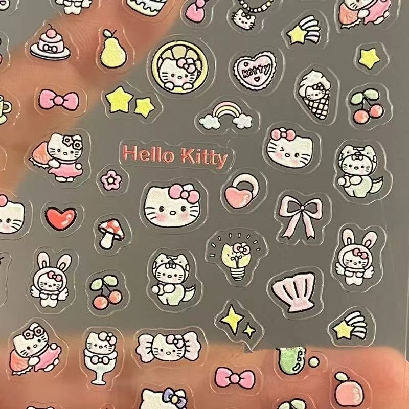 赤い本と同じ高颜値のケイティの携帯電話はかわいいハローキティの猫のネイルシールの爪を貼って絵を貼ります。|undefined