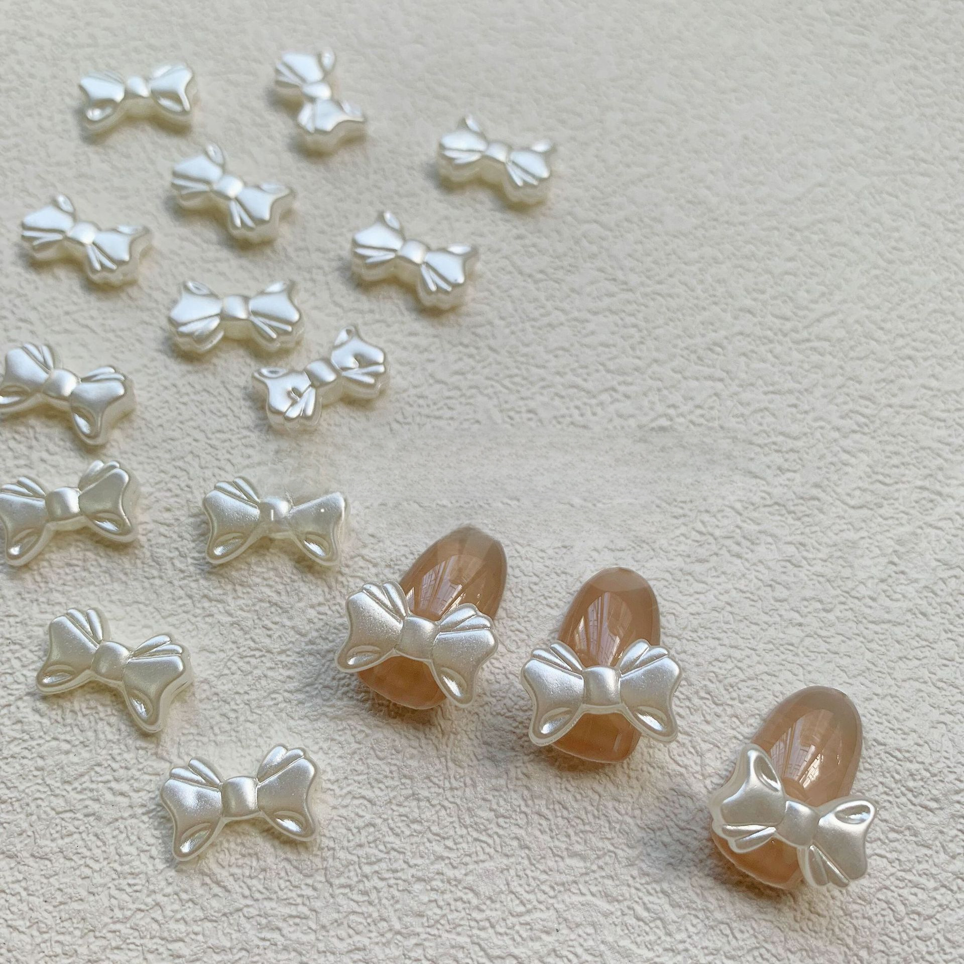 Beige three dimensional Japanese nail decoration pearl with bow