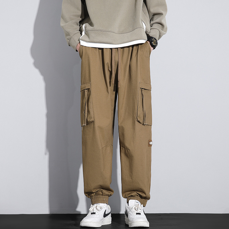 Nuevos pantalones de trabajo de alta calidad de primavera para hombres, moda multibolsillos con tendencia universal