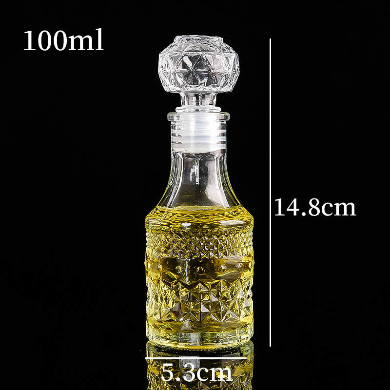 Botella de vino pequeña tallada de vidrio transparente al por mayor, botella de vino extranjero, botella de vino tinto, botella de whisky de estilo europeo, botella de vino de frutas de bodega