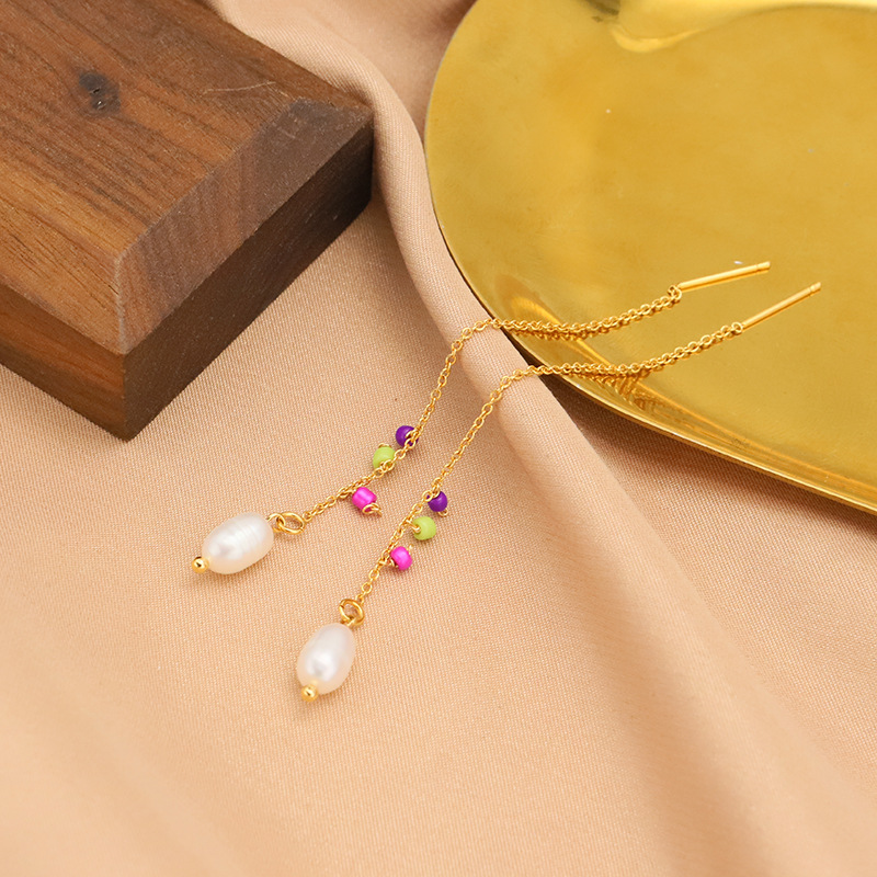 Pendientes de perlas naturales de agua dulce pendientes femeninos nicho de alto grado pendientes anillo de joyería original hecho a mano transfronteriza al por mayor