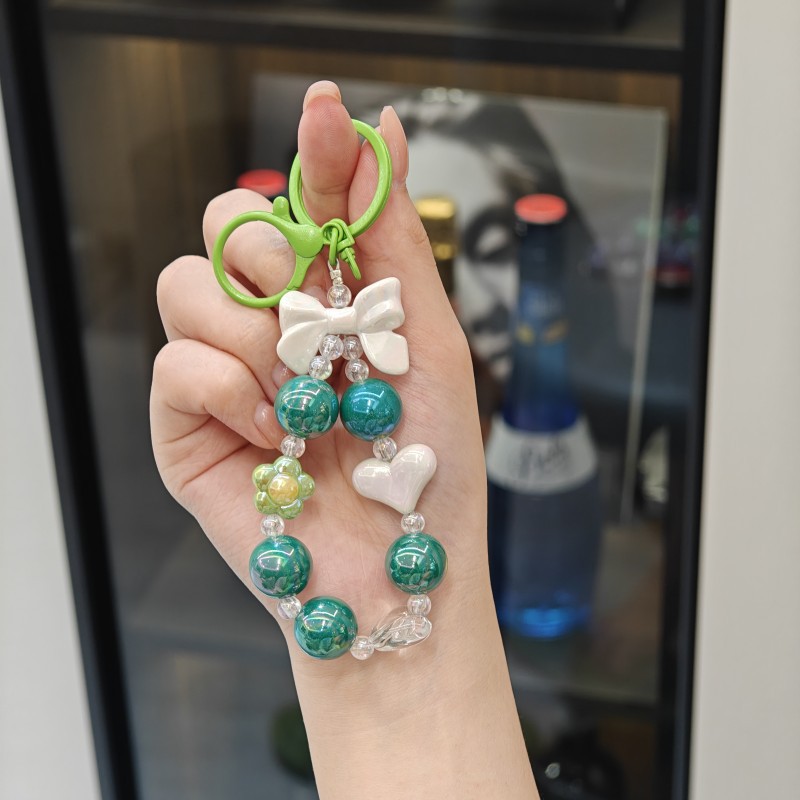 Creativo pequeño color caramelo fresco color chapado con cuentas llavero arco amor llavero bolsa pequeña colgante fuente