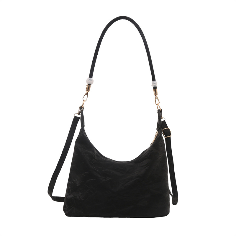 2024 nueva bolsa de mujer de estilo extranjero, gran capacidad de ocio, este año, bolsas populares de hombro y brazo.