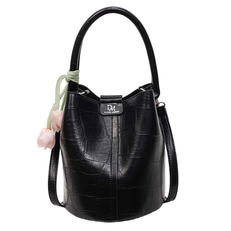 Bolso de cubo de jardín de verano 2025 nuevo bolso de mano estilo extranjero bolso de hombro con patrón de piedra pequeño bolso de mensajero fresco para mujer