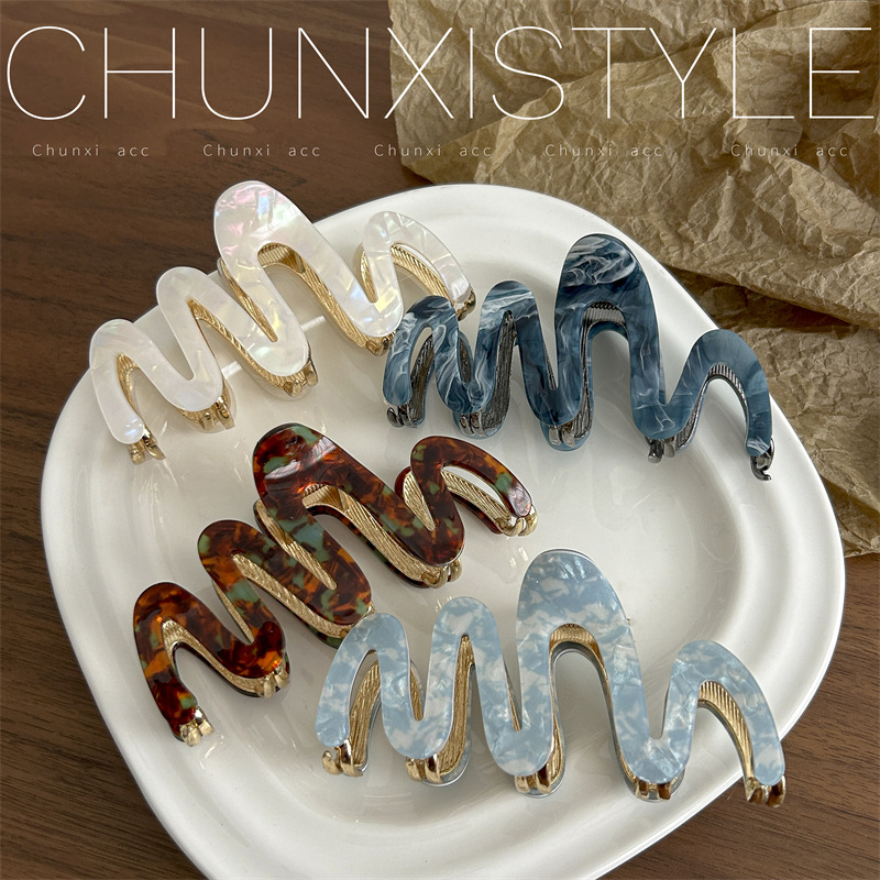 High-end acetate hair clips for women with wavy hair, perfect for updos, shark clips, and gentle on hair.