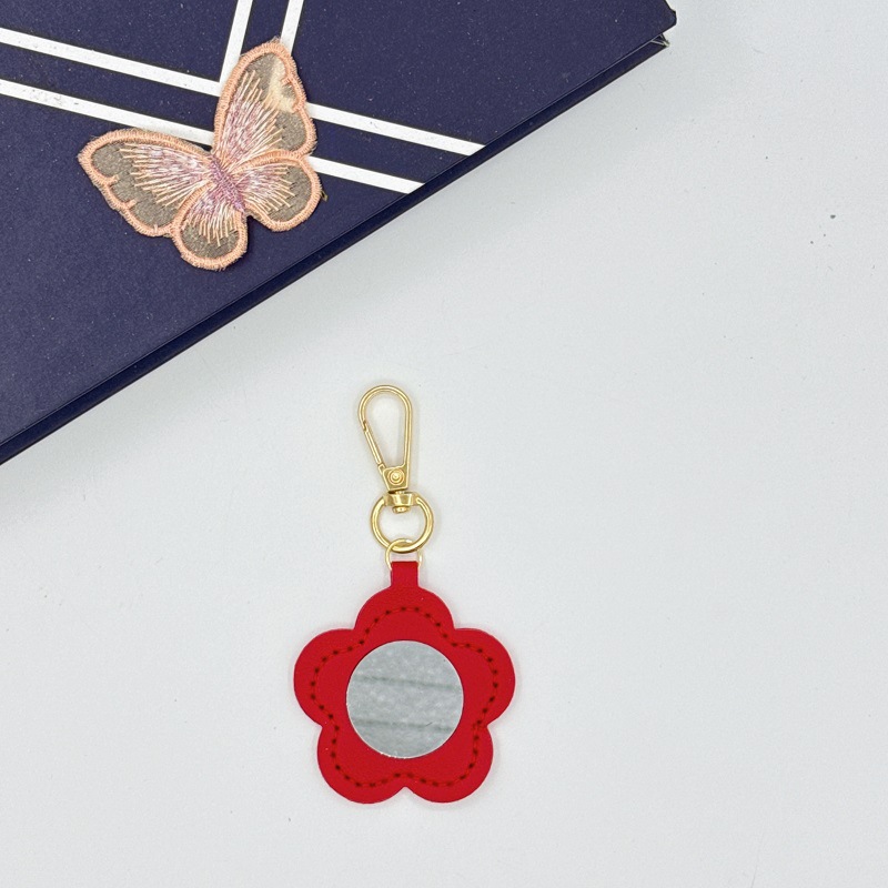 Flor espejo llavero cuero transfronterizo regalo colgante joyería creativo mini lápiz labial almacenamiento llavero colgante