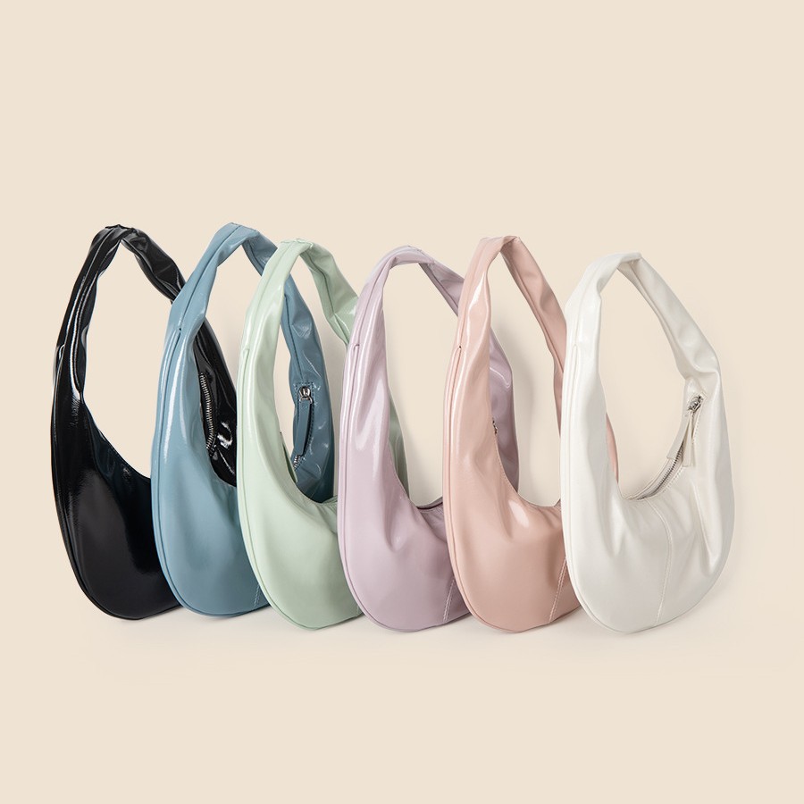 Personalized and fashionable cream colored patent shiny bread PU leather versatile Korean version hand-held armpit_voghion.com