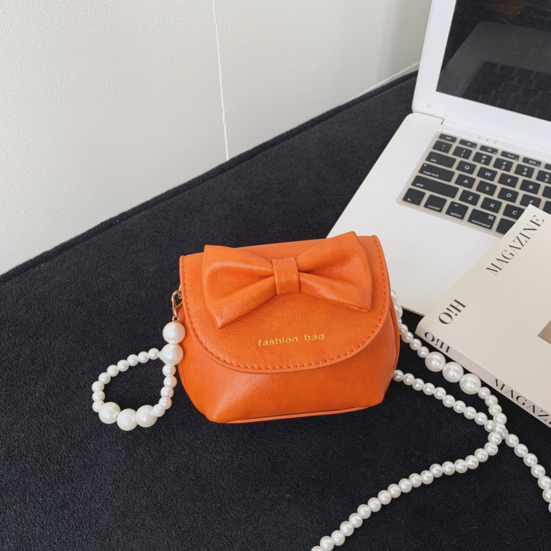 Cute mini niñas bolso de hombro dulce perla bolso de bebé coreano nuevo bolso de cambio de color sólido para niños