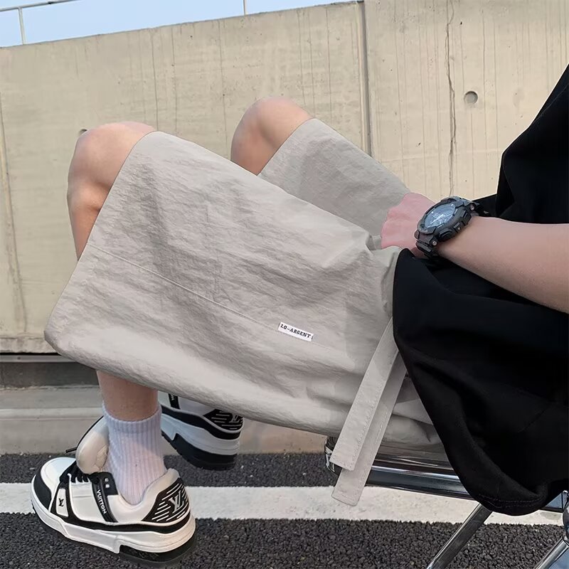 Pantalones cortos deportivos de secado rápido rosa dopamina para hombres 2025 nuevos pantalones de verano de talla grande pantalones sueltos casuales de cinco puntos