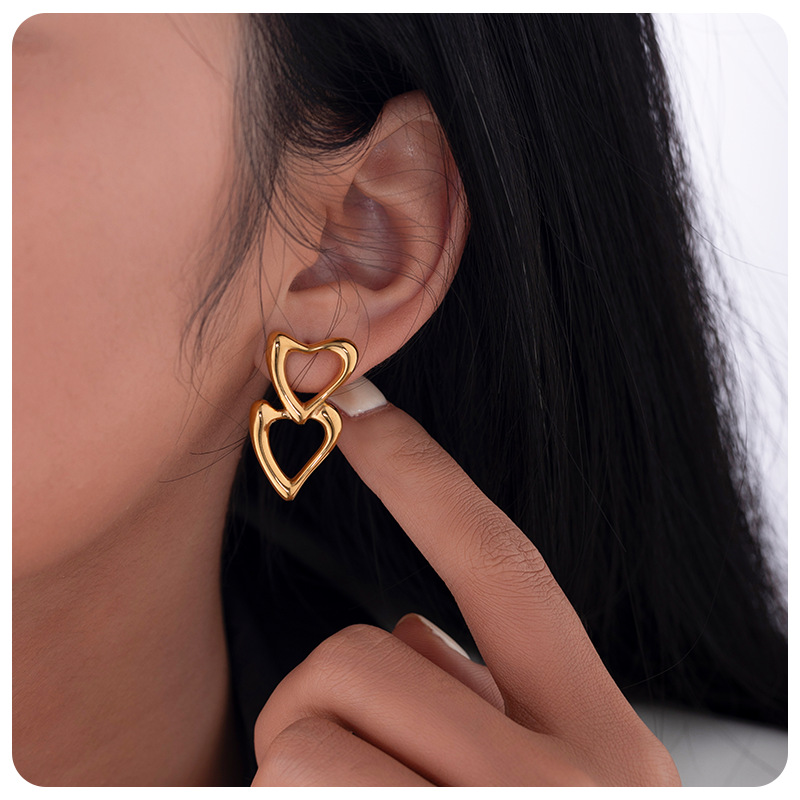 TENA nicho de amor amor amor hueco pendientes de acero inoxidable chapado en oro 18 quilates doble goteo de zircón pendientes de aceite