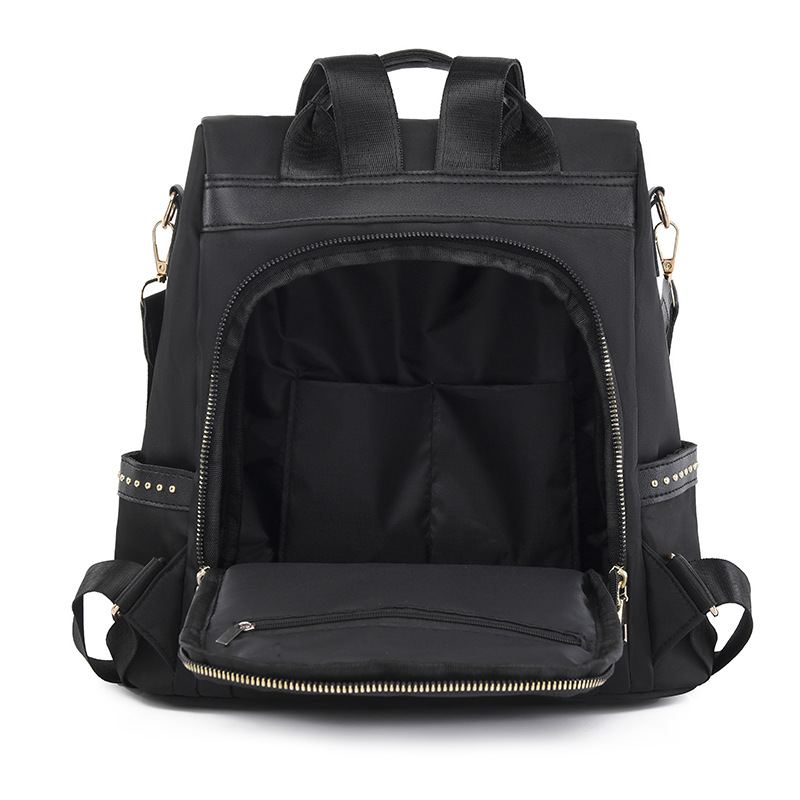Venta al por mayor 2023 nuevo estilo casual mochila antirrobo mujer simple moda Oxford tela remache mochila escolar de doble uso