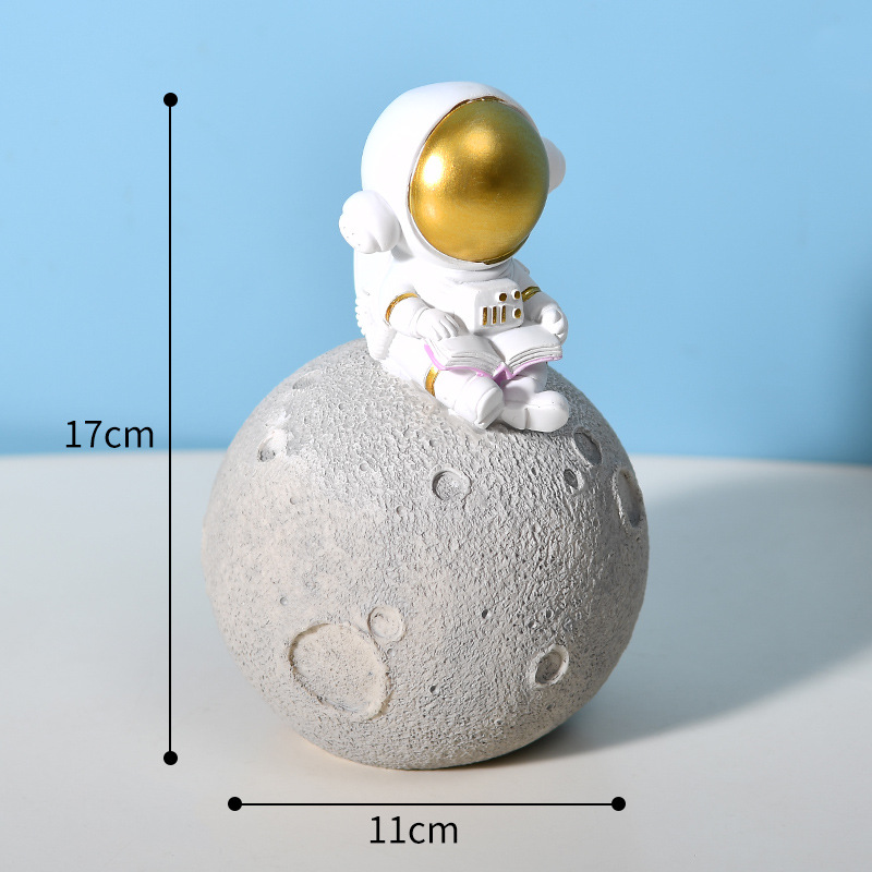 Astronaut, golden moon, piggy bank