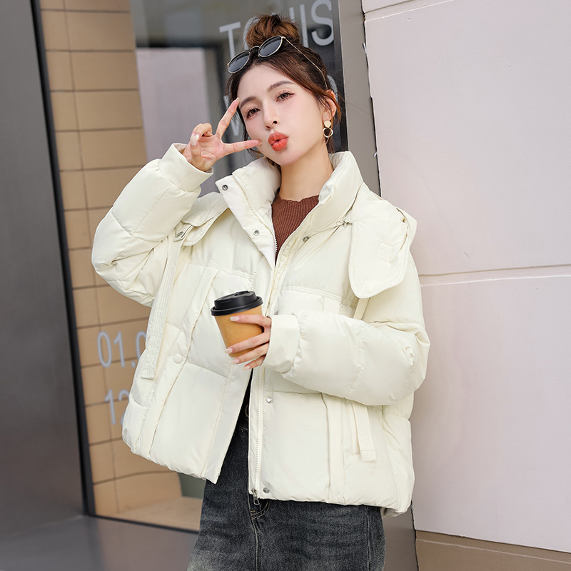 Corea del Sur Dongdamen ropa de algodón de pluma para mujeres corto 2025 invierno nuevo algodón delgado chaqueta con capuz transfronteriza