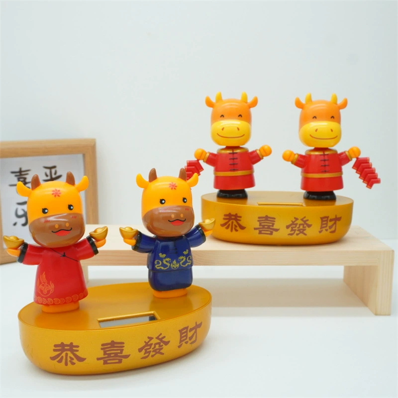 Трансграничные петарды корова солнечные автоматические качели кукла автомобиль качая головой украшение креативное украшение автомобиля