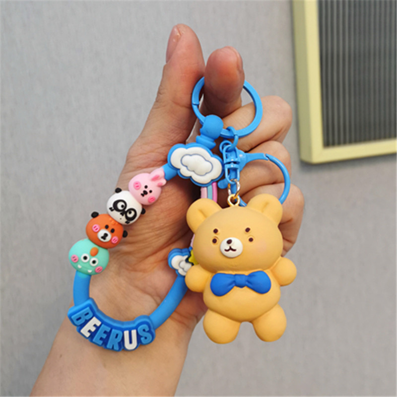 Colorido Berus dibujos animados cuerda Rana conejo llavero colgante Cadena de teléfono móvil fresco color sólido conjunto auriculares