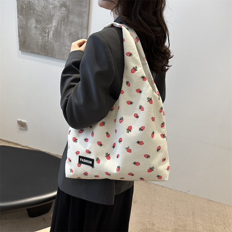 Bolso de meandruño 2024 nuevo hombro de gran capacidad bolso de mano de transporte literario versátil impresión brazaleta