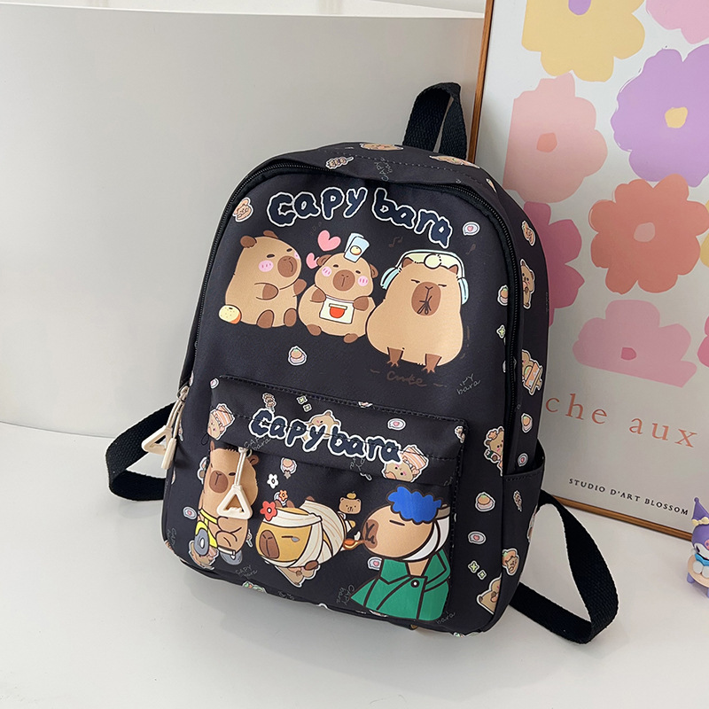 Nueva mochila de gran capacidad dibujos animados encantador impresión de estudiantes de primaria y secundaria reducción de presión de la espalda ocio versátil doble espalda