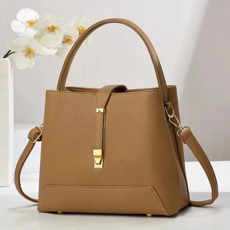 Fabricante bolsos de mujer 2025 nuevo bolsos de mano texturas coreanas de hombro de una sola forma de bolsos de cubo de mujer bolsos