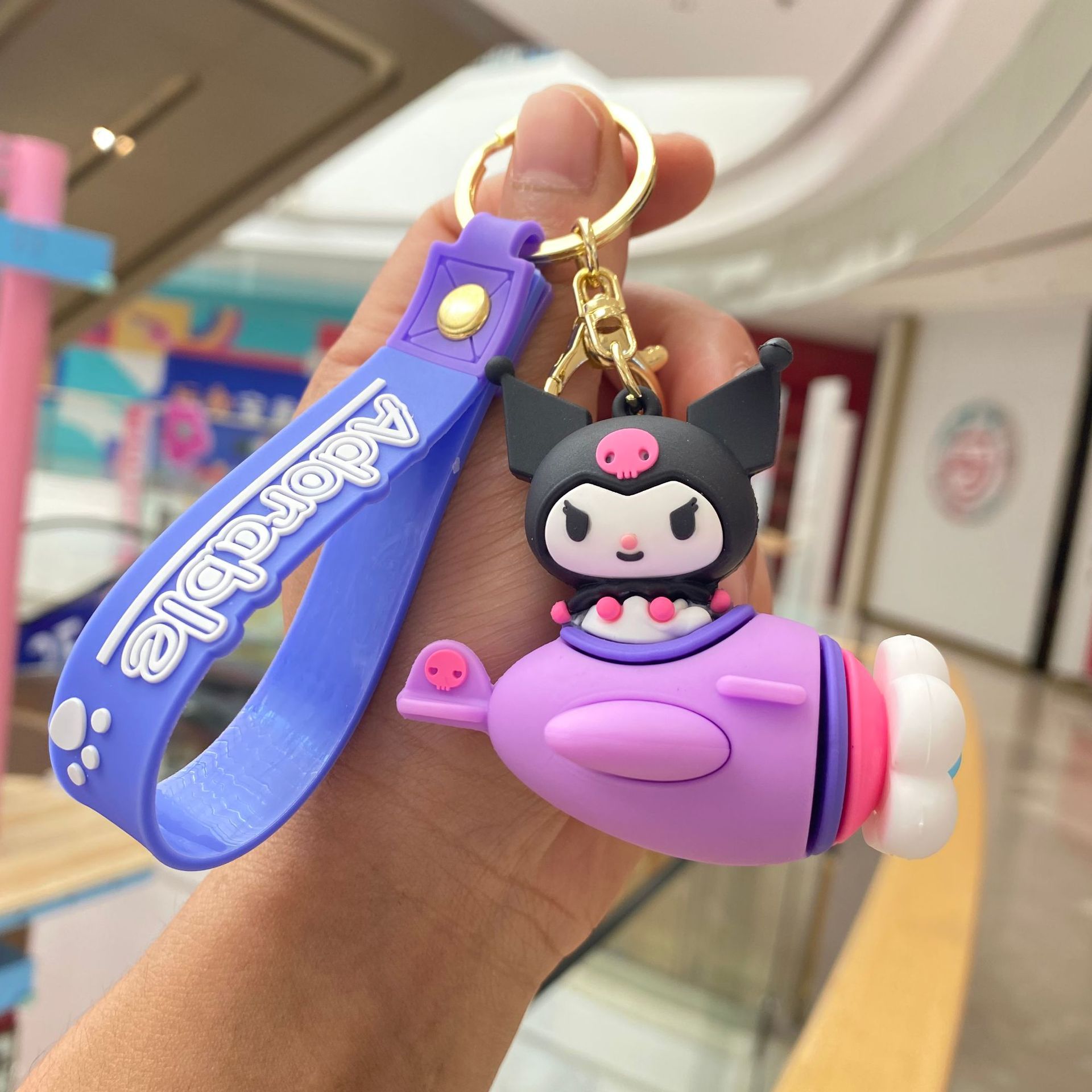 Creativo de dibujos animados Sanrio giratoria dulce avión llavero coolomi muñeca llavero pequeño regalo al por mayor