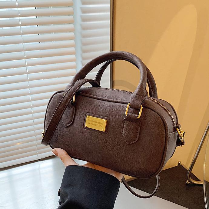 Bolso de bolos de mano de moda 2024 nuevo bolso de mujer retro simple bolso de hombro de alta calidad bolso de mochila universal mujer