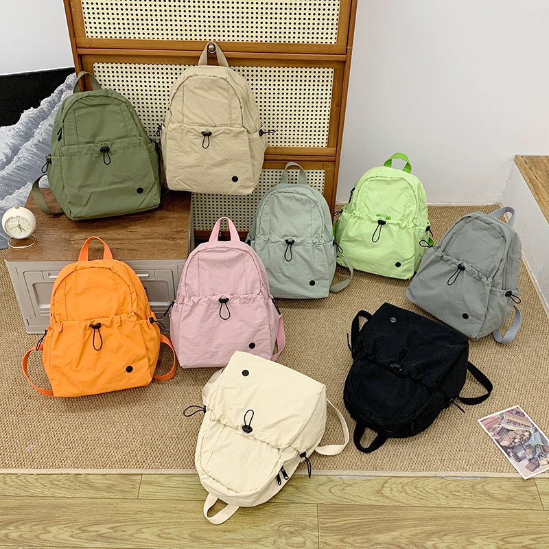 Mochila escolar de gran capacidad para estudiantes de primaria, color sólido simple, mochila casual ligera para niños y niñas 2025 nueva mochila para niños