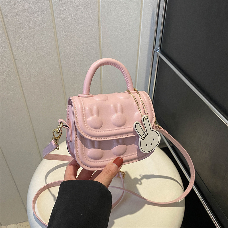 Bolsos para niños, bolsos de mochila encantadores, bolsos de moda de dibujos animados, bolsos de montar de mano, bolsos de cambio para bebés de niñas