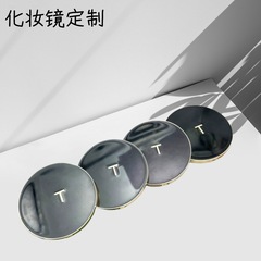 メーカーがカスタマイズした新しい高価値ブラックゴールドラウンド両面折りたたみ化粧鏡、シンプルなデザイン、ポータブル小型ミラー