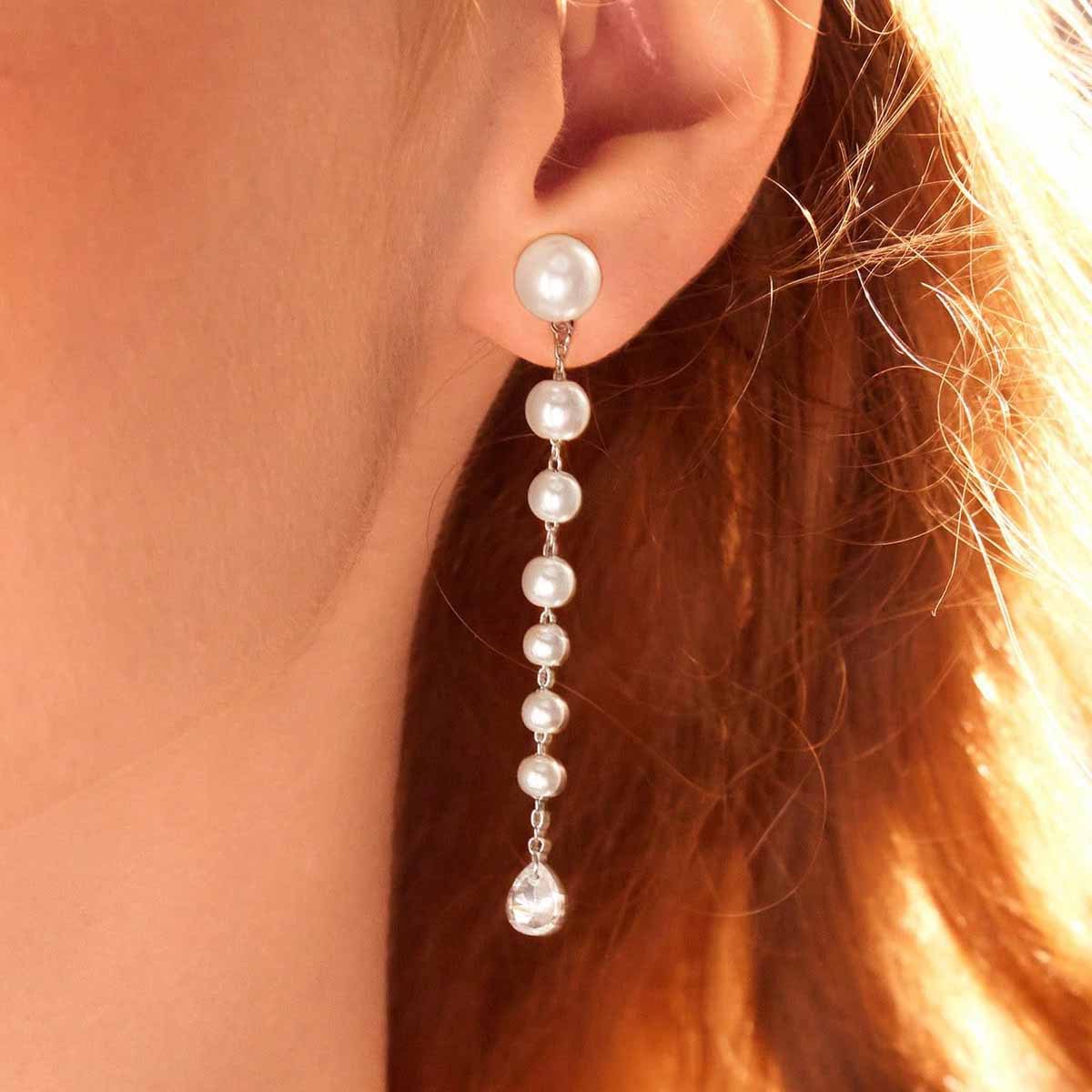Elegant earrings with tassels from pearl