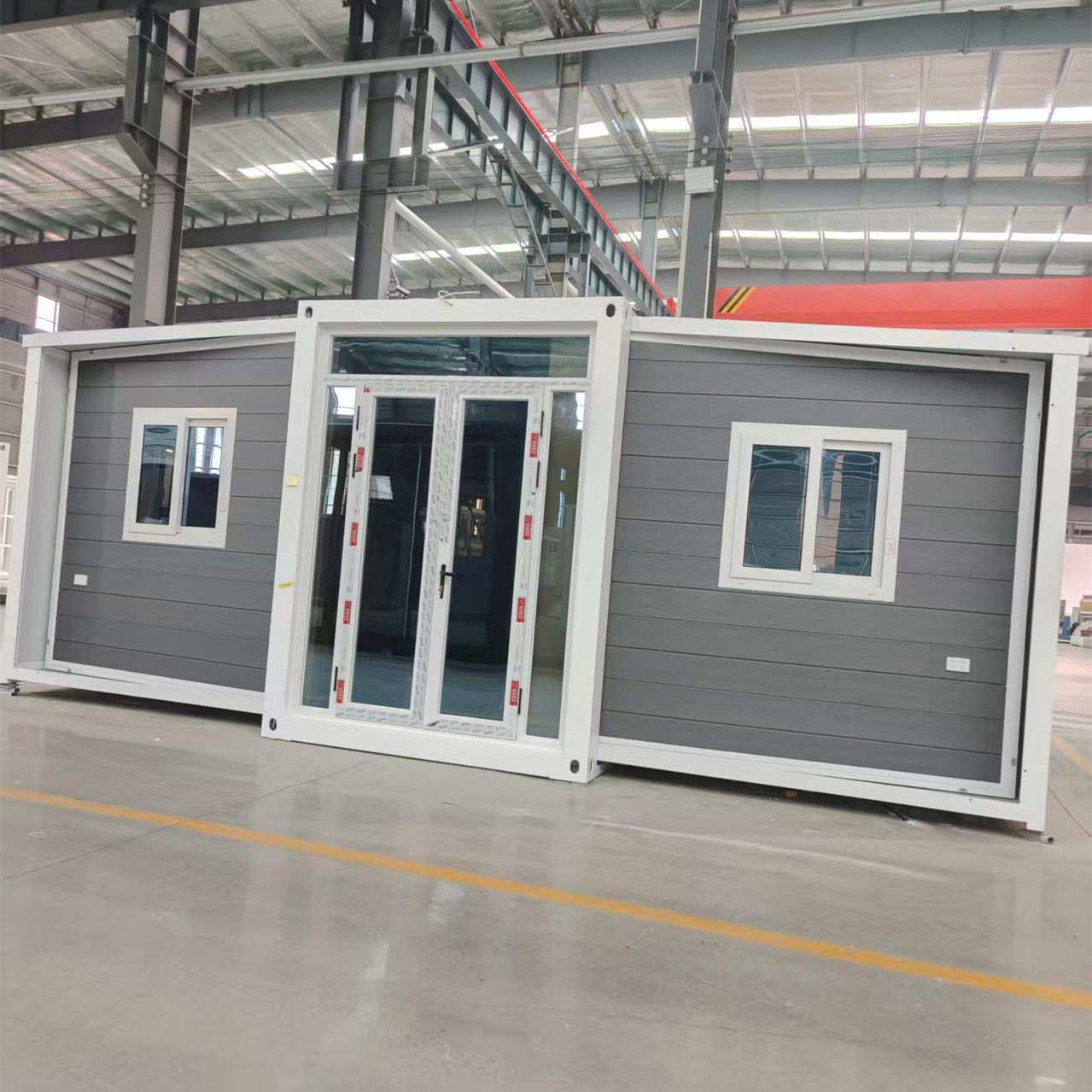 Fábrica al por mayor doble ala expansión plegable temporalmente oficina sitio de construcción puede alojamiento móvil sala integrada rápida