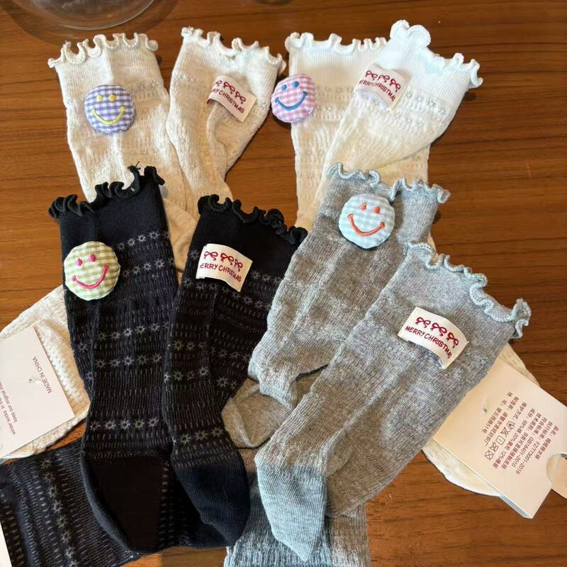 2026 Japanese-Style Cute Mid-Tube Socks with Ruffled Edges, Fabric Tags, Hollow-Out Design, Korean Version, 3D Doll Smiley Face Decoration, Slouch Socks 2026 Japanese-Style Cute Mid-Tube Socks with Ruffled Edges, Fabric Tags, Hollow-Out Design, Korean Version, 3D Doll Smiley Face Decoration, Slouch Socks