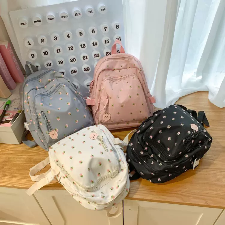 2024新款时尚双肩包高级感印花书包中大学生轻便大容量卡通书包女