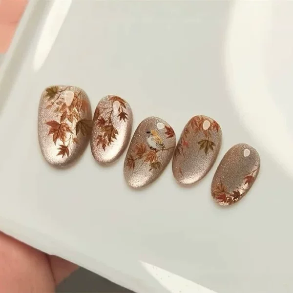 Chinese-style ink painting maple leaf and bird cat-eye press-on nails, high-end fine glitter medium oval false nails with a vintage autumn vibe