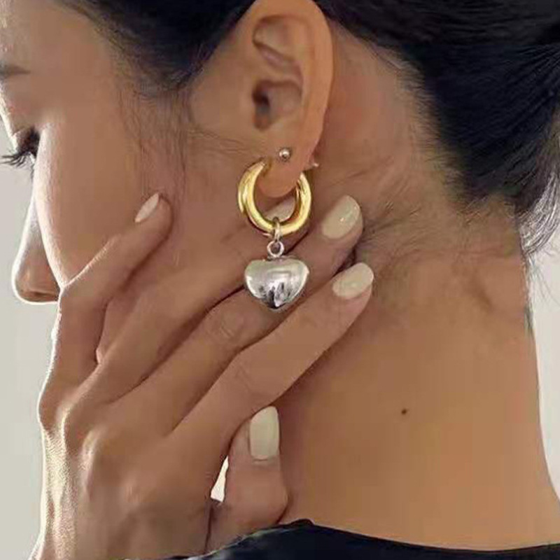 Europa y los Estados Unidos transfronterizos nuevos pendientes de corazón de corazón de oro retro inflables espejo estereoscópio exagerado alta sensación auriculares