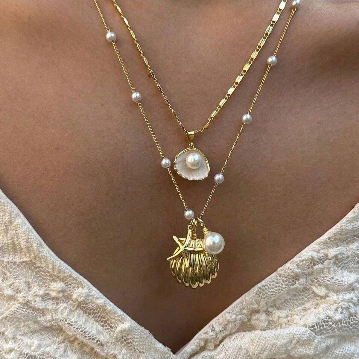 Venta caliente transfronteriza europea y americana Cadena de perlas marinas Cadena de clavícula Colgante de concha de estrella de mar Joyas de collar apilables multicapa