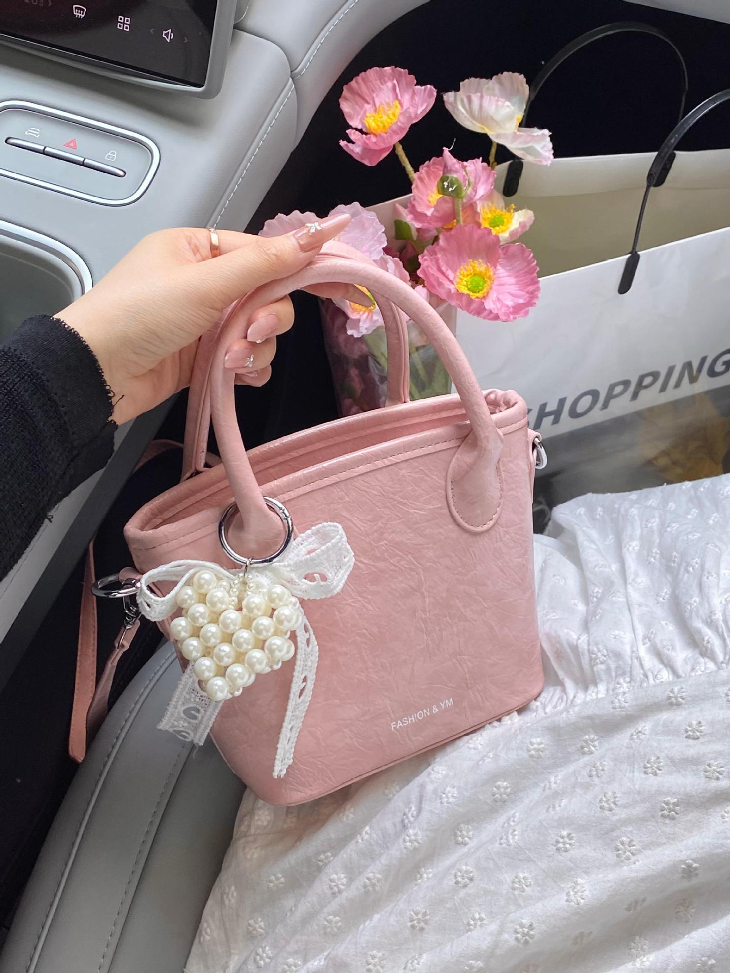 Bolso de cubo de mano súper caliente de comercio exterior 2025 nuevo bolso de hombro de tendencia salvaje de moda bolso de mensajero de nicho de alta gama de moda