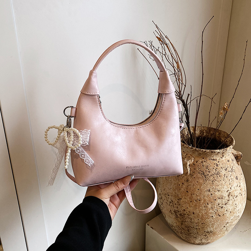 Stilvolle, elegante Damenhandtasche für den Arbeitsweg, neue Sommermode 2026 mit Schleife, Schulter-, Achsel- und Handtasche._voghion.com