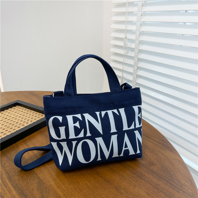 Venta al por mayor transfronteriza GW Tailandia Xiaoyou bolsa de lona diseño de nicho carta portátil de gran capacidad bolsa de mensajero del hombro