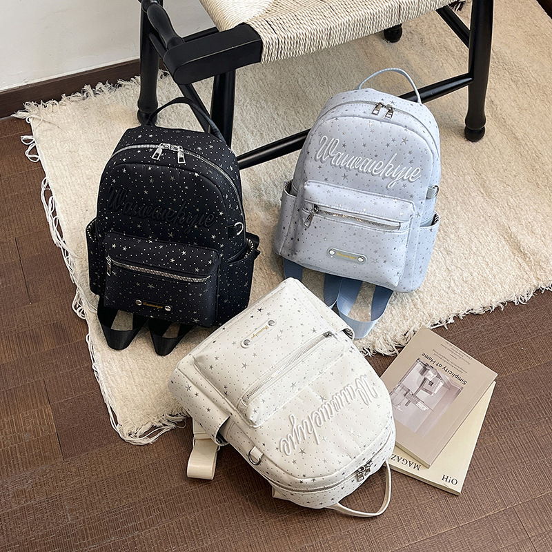 Korean-style ins fashion letter and star design backpack for women, niche design, simple and versatile, suitable for commuting and student use Korean-style ins fashion letter and star design backpack for women, niche design, simple and versatile, suitable for commuting and student use
