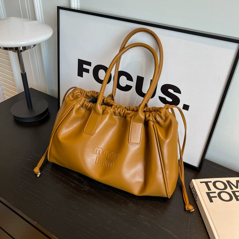 Universal small design shoulder bag, capacious one-shoulder bag, 2023 collection, genuine leather, drawstring