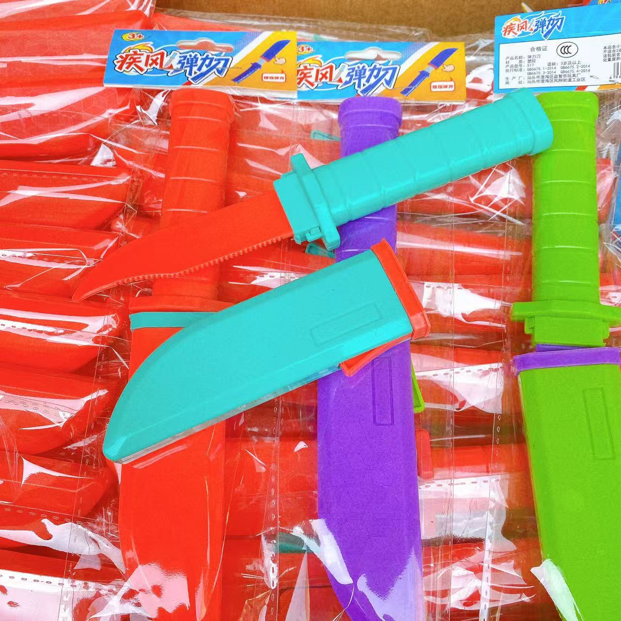 Cuchillo de resorte telescópico cuchillo de rábano colorido espectáculo de hechicería accesorios automáticamente bolsa de nuevo lote de juguetes infantiles