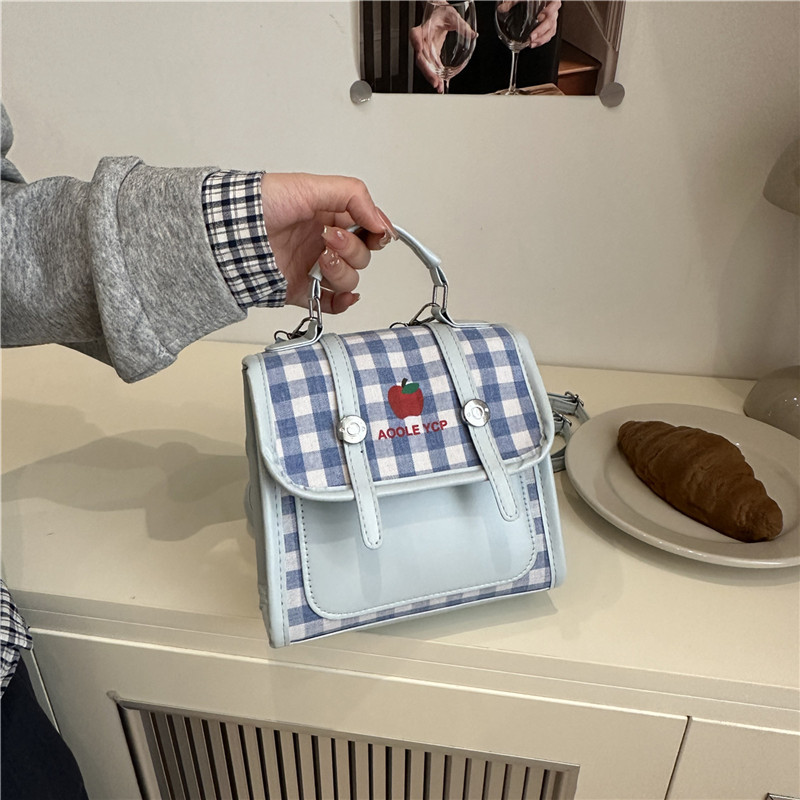 Color contrastante estampado a cuadrícula pequeña y fresca mochila de clase nueva versión coreana de transporte múltiple mochila de moda