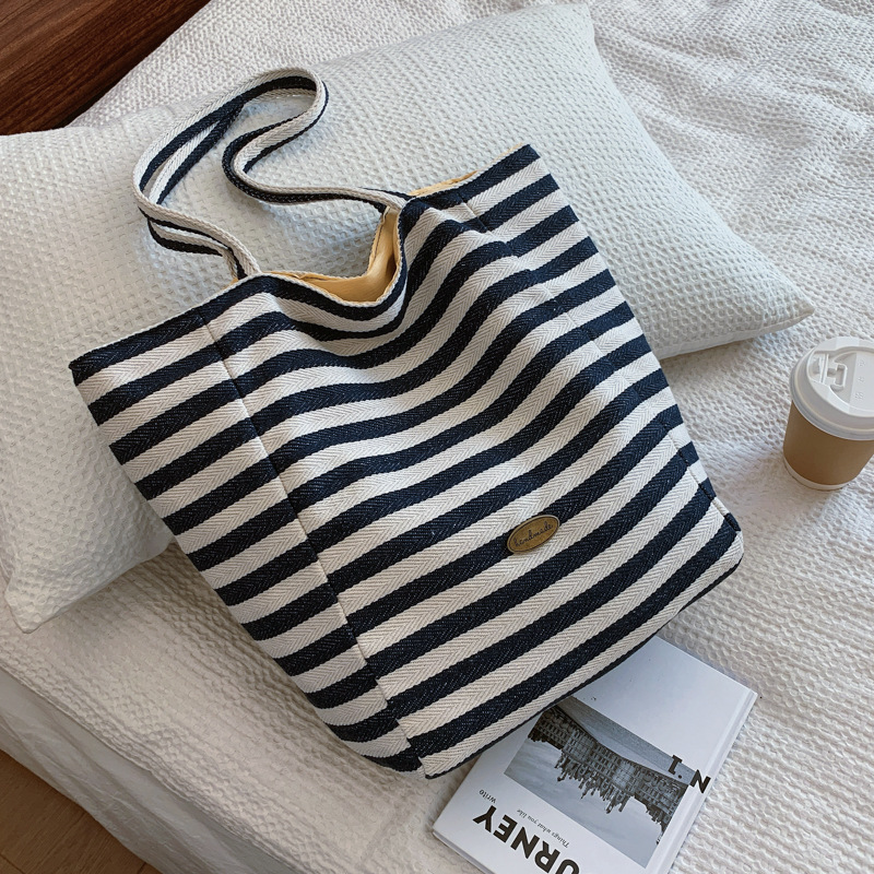 Bolsas de lona a rayas de doble cara nicho de mujeres coreanas de gran capacidad perezosa bolsas de compras de ocio de estudiantes