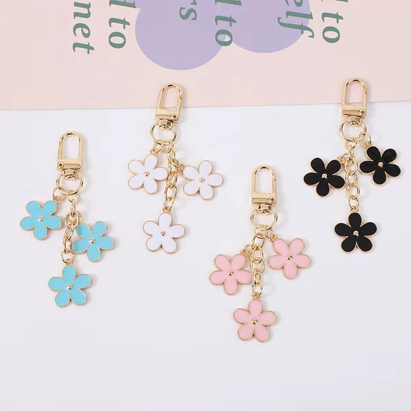 New color flower keychain bag ornaments Amazon alloy double-sided small flower headphone pendant wholesale