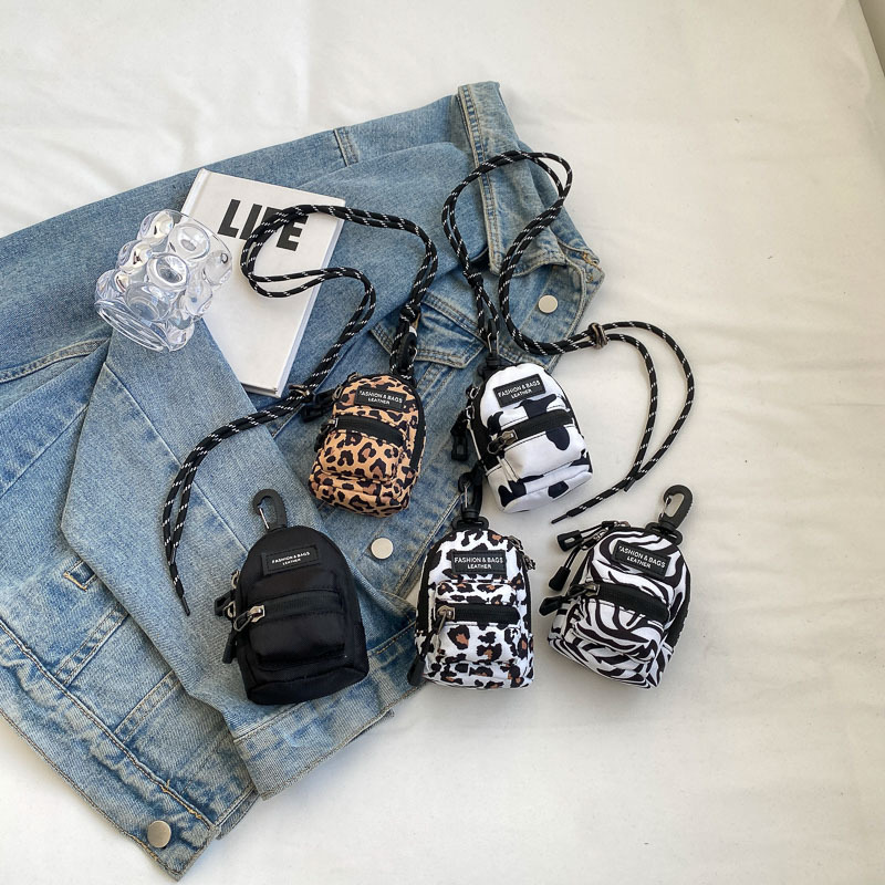 Mini bolso para niños coreano comercio exterior popular leopardo chica mochila de hombro bolso de auriculares de viaje al aire libre bolso de lápiz labial