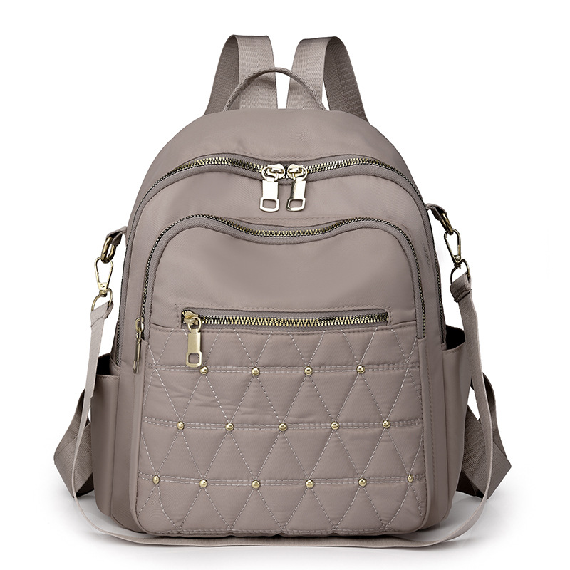 Mochila con remaches bordados de ringge para mujer 2025 nueva bolsa de viaje de moda casual todo-fósforo de gran capacidad para mujer