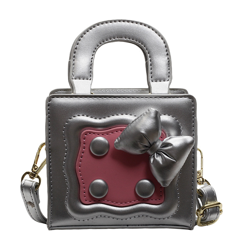 Bolso lindo japonés 2025 primavera nuevo bolso femenino lazo en contraste bolso de hombro mini bolso de mensajero para niños