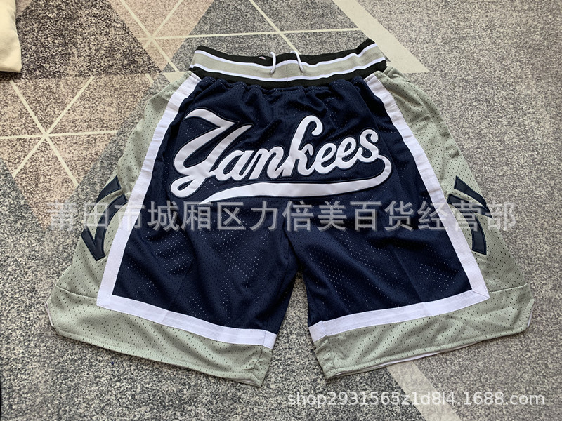 Comercio exterior pantalones de fútbol al por mayor Warriors Lakers 76 caliente Raptor mágico bolsillo bordado pantalones cortos pantalones de baloncesto NFL