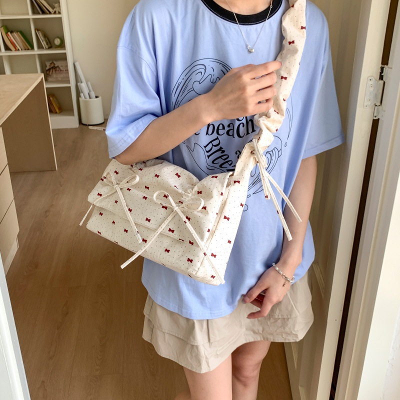 Bolso de moda coreano 2025 verano nuevo bolso femenino lindo lazo bolso de hombro fresco plisado bolso de mensajero