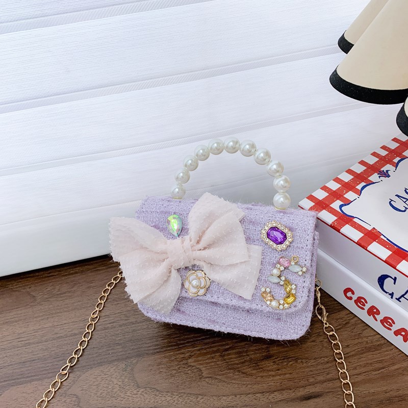 Bolso de cinturón para niños bolso de cambio pequeño viento perla de moda bolso de arco bolso de niña linda